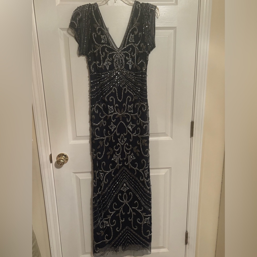 Pissarro Nights Jeweled size 14 with slit in the back and  zipper.